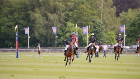 Polo-player-hits-the-ball-at-full-canter-whilst-being-chased-by-the-opposing-team