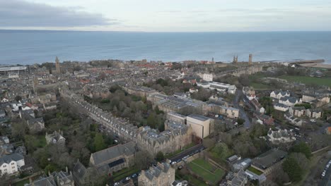 Aerial-Push-In-Of-Saint-Andrews,-Town-And-Saint-Andrews-Cathedral-In-Background