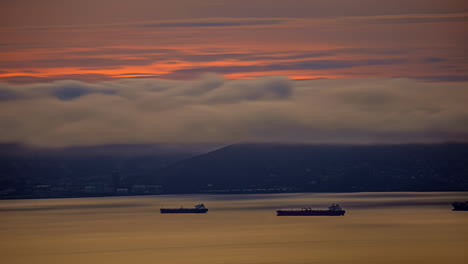 San-Francisco-Bay-seen-from-Oakland-California-with-low-clouds-over-freight-ships-in-the-harbor---cloudscape-time-lapse