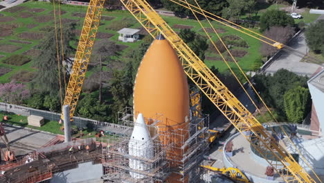 Close-up-of-nose-of-Space-Shuttle-Endeavour-External-tank-with-scaffolding,-aerial