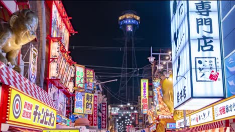 Time-lapse-of-Osaka-by-Night:-Tsutenkaku-Tower-with-Crowds-and-city-lights-at-the-vibrant-Ebisu-Higashi-District