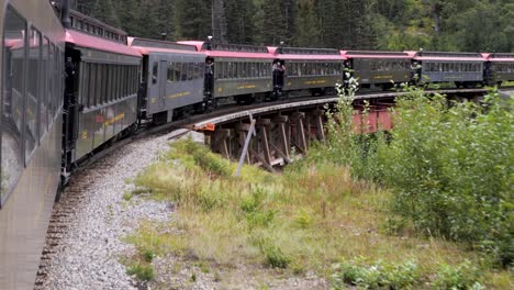 Skagway-White-Pass-train-and-Yukon-Route,-crossing-over-the-bridge