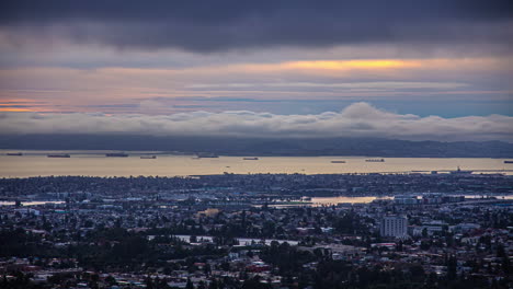 San-Francisco-Bay-with-cargo-freight-ships-anchored-in-the-harbor---Oakland-California-sunset-twilight-time-lapse