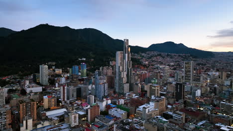 Flying-around-the-BD-Bacatá-,-sundown-in-Bogota,-Colombia---Aerial-view