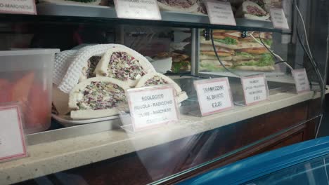 Italian-sandwich-display-in-food-store,-Venice-Italy