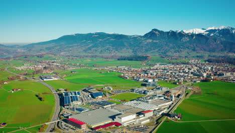 Panorama-Aerial-View-Of-Bulle-Town-And-Industrial-Site-In-Canton-Of-Fribourg,-Switzerland