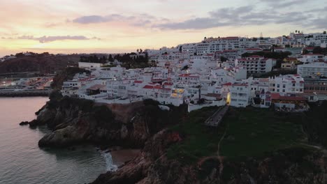 Panoramic-Aerial-View-Of-Seaside-Town-During-Sunset-In-Portugal