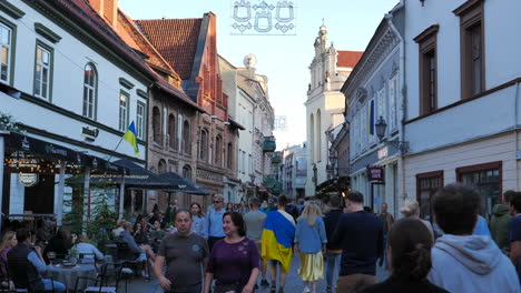 Crowd-of-people-sightseeing-around-Vilnius-old-town-touristic-street-in-Lithuania