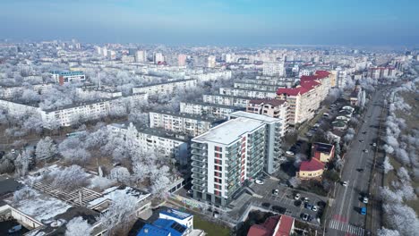 Aerial-View-Of-High-rise-Buildings-And-Ice-covered-Trees-During-Winter-In-Galati,-Romania