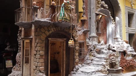 Model-figurines-in-staged-atmospheric-theatrical-historical-Italian-street-scene