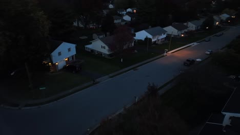 Car-driving-in-American-neighborhood-at-night