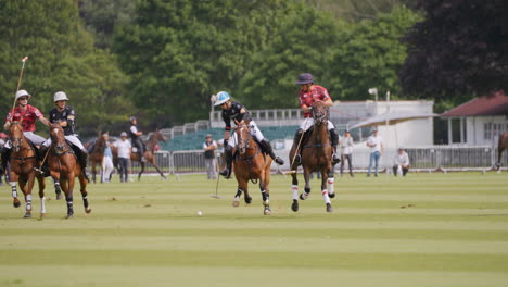 A-polo-ball-is-hit-into-the-air-and-galloped-after-by-several-players-on-horseback