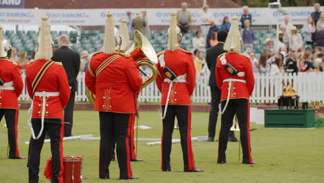 The-Household-Cavalry-band-wait-for-the-Queen-to-present-polo-trophies-to-winning-team