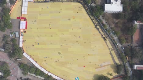Rajkot-kite-festival-aerial-drone-view-Camera-moving-forward-where-many-people-are-watching-and-enjoying-the-big-kite
