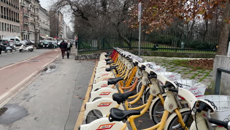 BikeMi-bike-rental-service-in-Milan,-Italy-Wide-shot-slow-motion