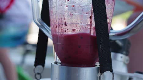 Smoothie-in-making-at-a-smoothie-bike-with-blurred-background