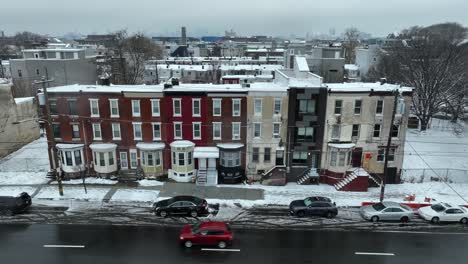 Row-houses-with-colorful-facades-on-a-snowy-street