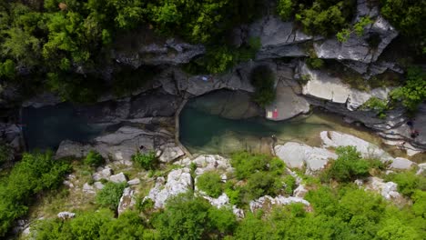 Birds-eye-view-of-Papingo-Rock-Pools,-Ovires-of-Rogovo-in-Greece,-stream-with-natural-ponds