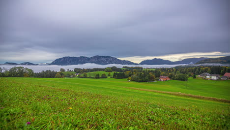 Time-lapse-of-clouds-and-fog-flowing-over-Attersee-town-landscape