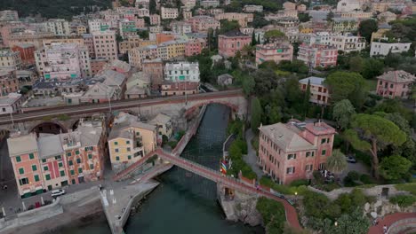 Genoa-nervi,-italy-with-colorful-buildings-and-lush-hills,-cloudy-sky,-aerial-view