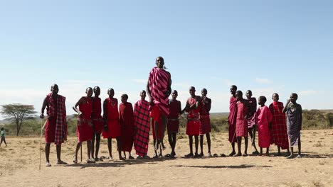 Maasai-Tribe-Men-In-Traditional-Adumu,-Jumping-Dance-In-Rift-Valley-Province,-Maasai-Mara,-Kenya