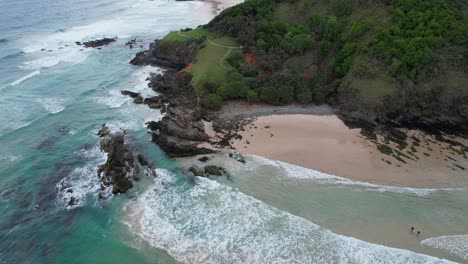 Headland-And-Ocean-At-Broken-Head-Beach,-Byron-Bay,-NSW,-Australia---Aerial-Pullback
