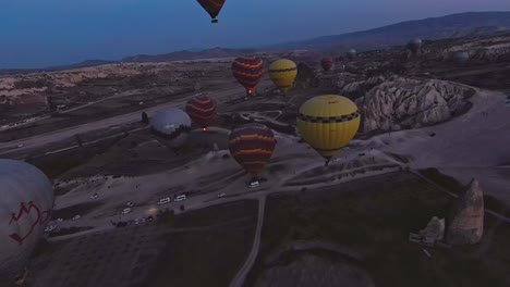 Cappadocia-Landscape-At-Sunrise-With-Flying-Hot-Air-Balloons-In-Turkey---Drone-FPV