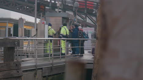 Busy-Venice-pier-with-workers-in-vibrant-safety-vests