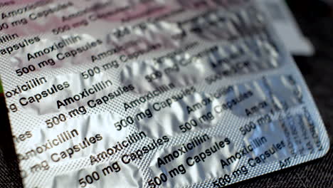 Amoxicillin-capsules,-oral-antibiotic-penicillin-medicinal-drug-in-silver-foil-protection