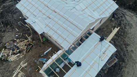 Aerial-shot-of-people-working-in-the-construction-process-of-a-house