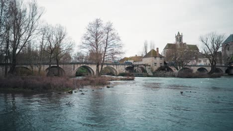 Profile-view-of-Moret-sur-Loing-city-under-cloudy-sky-in-France