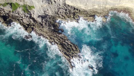 Waves-breaking-on-rocky-cliffs-of-Porte-d'Enfer-in-north-of-Grande-Terre-in-Guadeloupe,-France