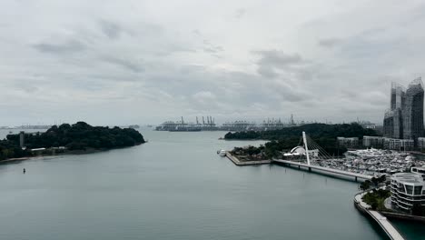 Drifting-Above-Keppel-Harbour,-With-a-View-of-a-Shipping-Yard-in-the-Distance-in-Singapore-From-a-Cable-Car---POV