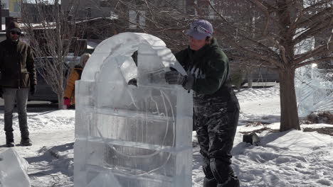 Ice-sculptor-crafting-ice-sculptures-in-slow-motion-detail