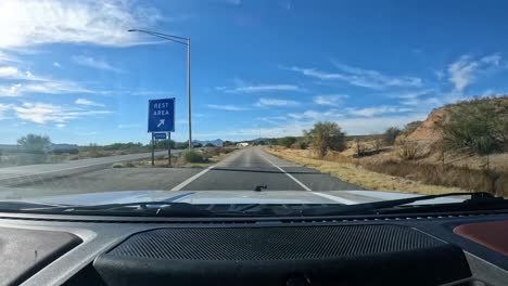 POV---Driving-into-the-Canoa-Rest-Area-off-of-Interstate-19-in-southern-Arizona-on-a-sunny-afternoon