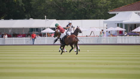 Polo-player-hits-the-ball-with-a-backswing-from-horseback