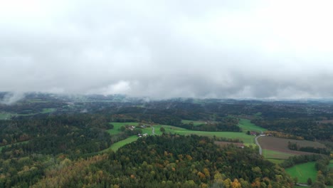Aerial-View-Of-Countryside-Landscape-With-Autumn-Forests-And-Fog-In-The-Morning---Drone-Shot