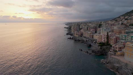 Genoa-nervi's-coastline-at-sunset-with-calm-sea-and-colorful-buildings,-aerial-view
