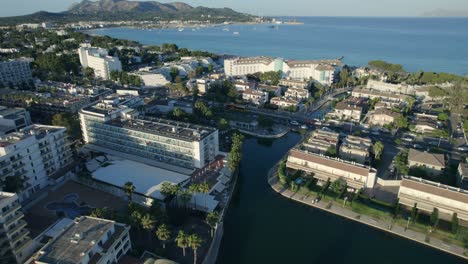 aerial-circle-pan-video-of-seaside-hotels-in-Palma-de-Mallorca,-Spain-during-sunny-day-in-summer