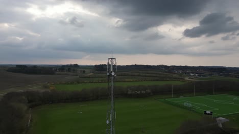 Footage-of-grid-mast,-captured-by-drone-circling-around-it