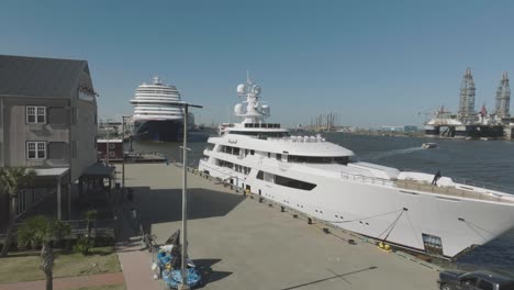 An-aerial-view-of-Tillman-Fertitta's-yacht-docked-at-Pier-21-in-the-historic-district-of-Galveston,-Texas