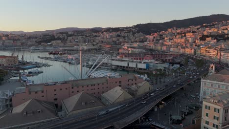 Golden-hour-view-of-Genoa's-historic-center-with-bustling-streets-and-marina