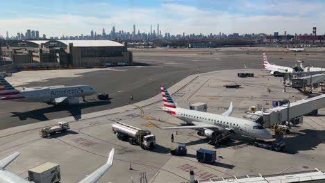 Planes-at-Gates-and-Taxiing-at-LaGuardia-Airport-with-NYC-Skyline-in-Distance