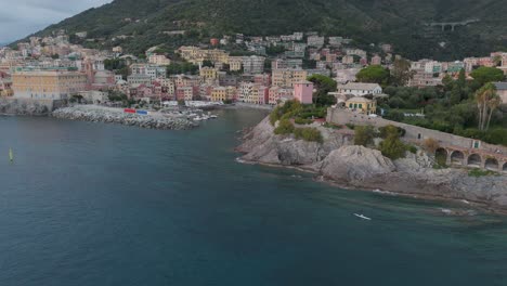 Coastal-view-of-Genoa-Nervi,-Italy-with-colorful-buildings-and-calm-sea,-aerial-shot