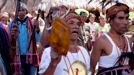 Timorese-people-performing-a-cultural-welcome-ceremonial-performance-of-singing-and-dancing-wearing-traditional-tais-clothes-attire-in-East-Timor,-Southeast-Asia