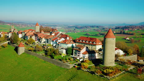Aerial-View-Of-Romont-Medieval-Village-With-Boyer-Tower-At-Fribourg,-Switzerland