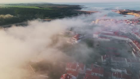 Foggy-Clouds-Over-Coastal-Town-Of-Lisbon,-Portugal-During-Sunrise
