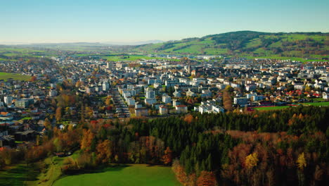 Aerial-Panorama-Of-Late-Autumn-Nature-Over-Bulle-Town-In-Canton-Of-Fribourg-In-Switzerland