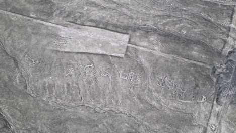 Aerial-view-above-the-Nazca-lines-and-humanoid-creatures-in-Nazca,-Peru