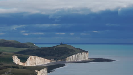Descending-aerial-shot-from-belle-tout-lighthouse-revealing-the-seven-sister-chalk-cliffs